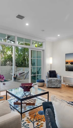 Clean white bedroom with wood ceiling