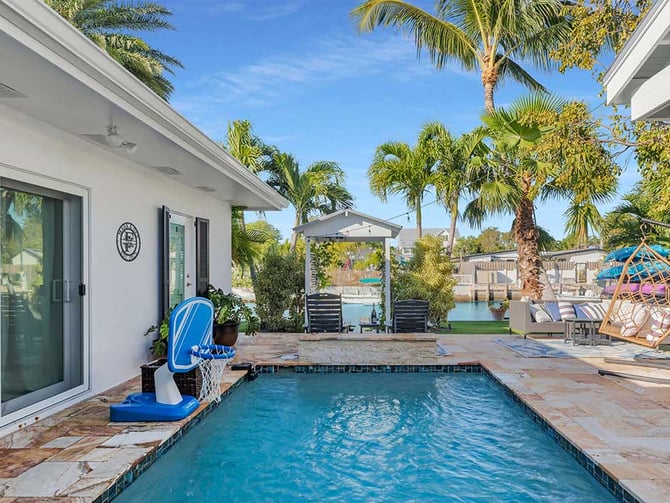 Private pool with canal view, gazebo and outdoor living